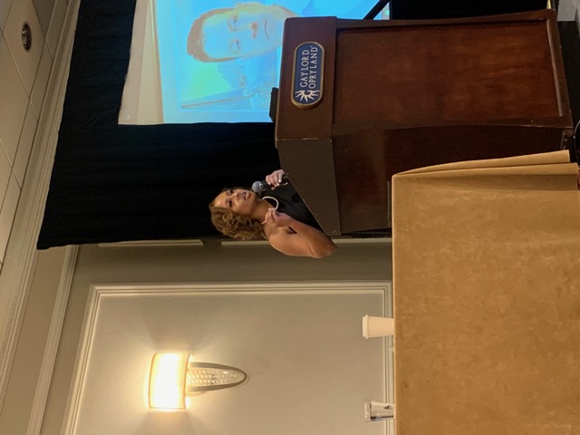 Jasmine R. Johnson speaking at a podium at the Gaylord Opryland